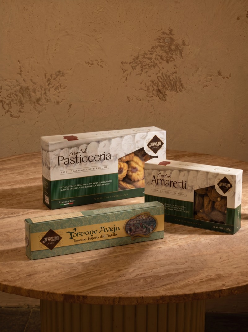 Generated scene — three boxes arranged as a still life on a travertine table
